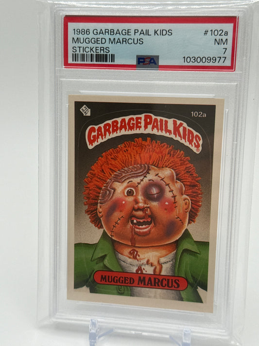 MUGGED MARCUS - GARBAGE PAIL KIDS STICKERS #102a  1986 SERIES 3 PSA 7